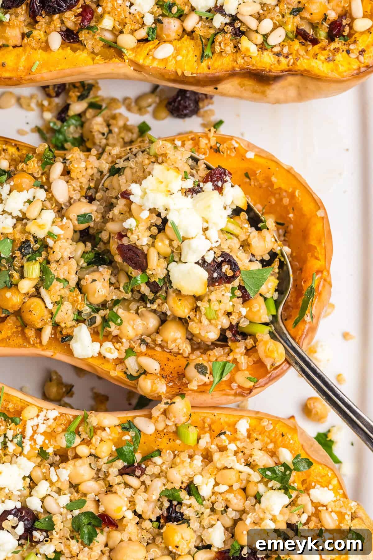 Sun-Kissed Mediterranean Stuffed Butternut 7 Mediterranean Stuffed Butternut Squash with a spoon and feta cheese