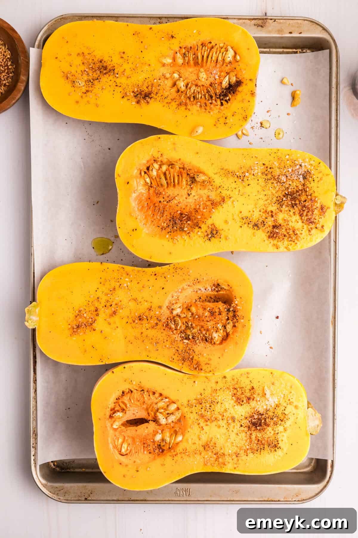 Sun-Kissed Mediterranean Stuffed Butternut 8 Mediterranean Stuffed Butternut Squash cut open squash on a baking sheet