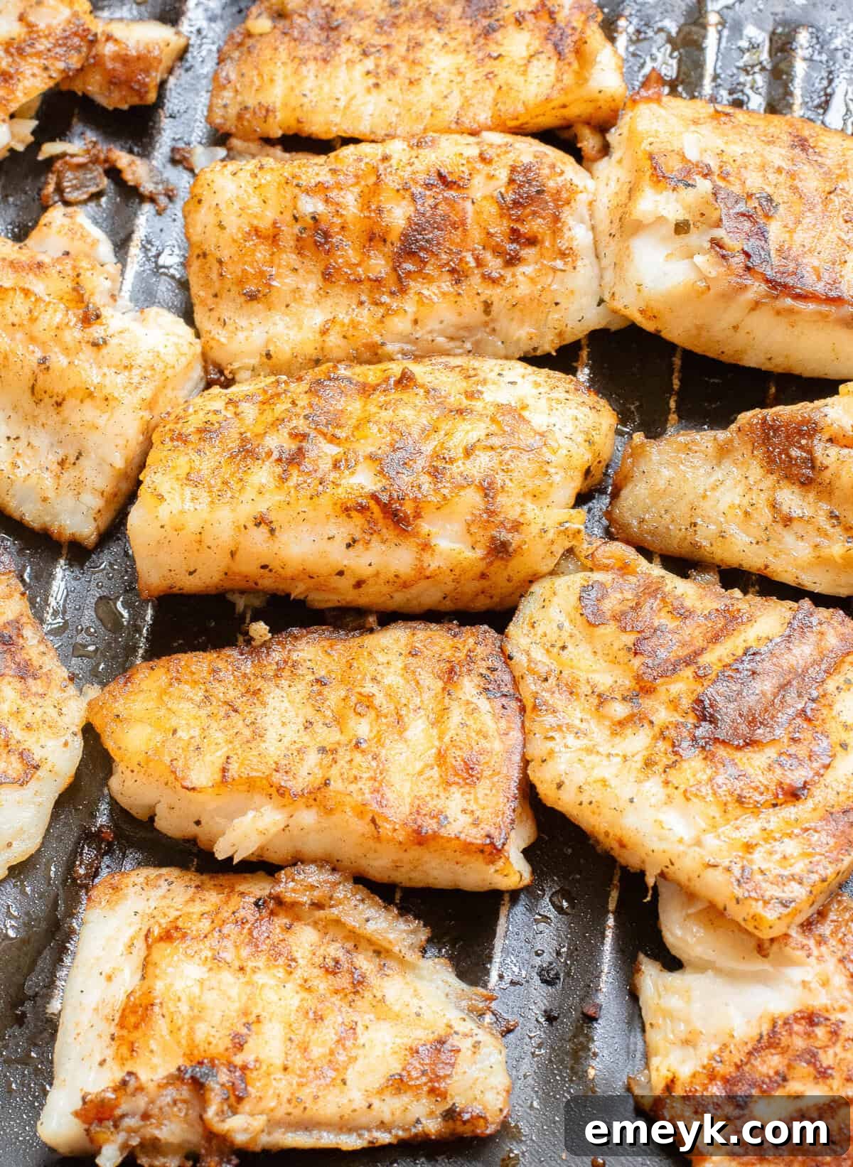 Blackened Fish Tacos cooking in a hot cast iron skillet