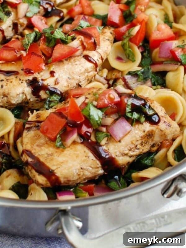 Close-up of golden brown chicken pieces in a skillet.