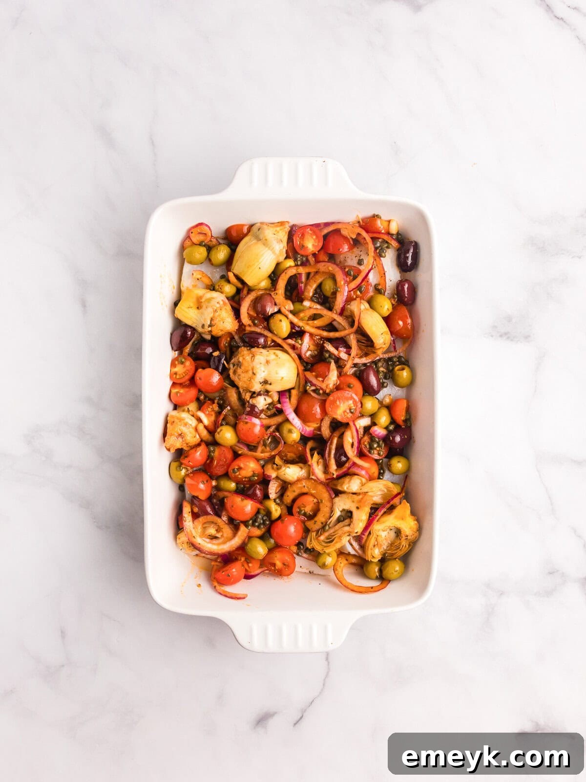 Sun-Kissed Mediterranean Fish Bake 10 Mediterranean Baked Fish in a dish with all ingredients arranged