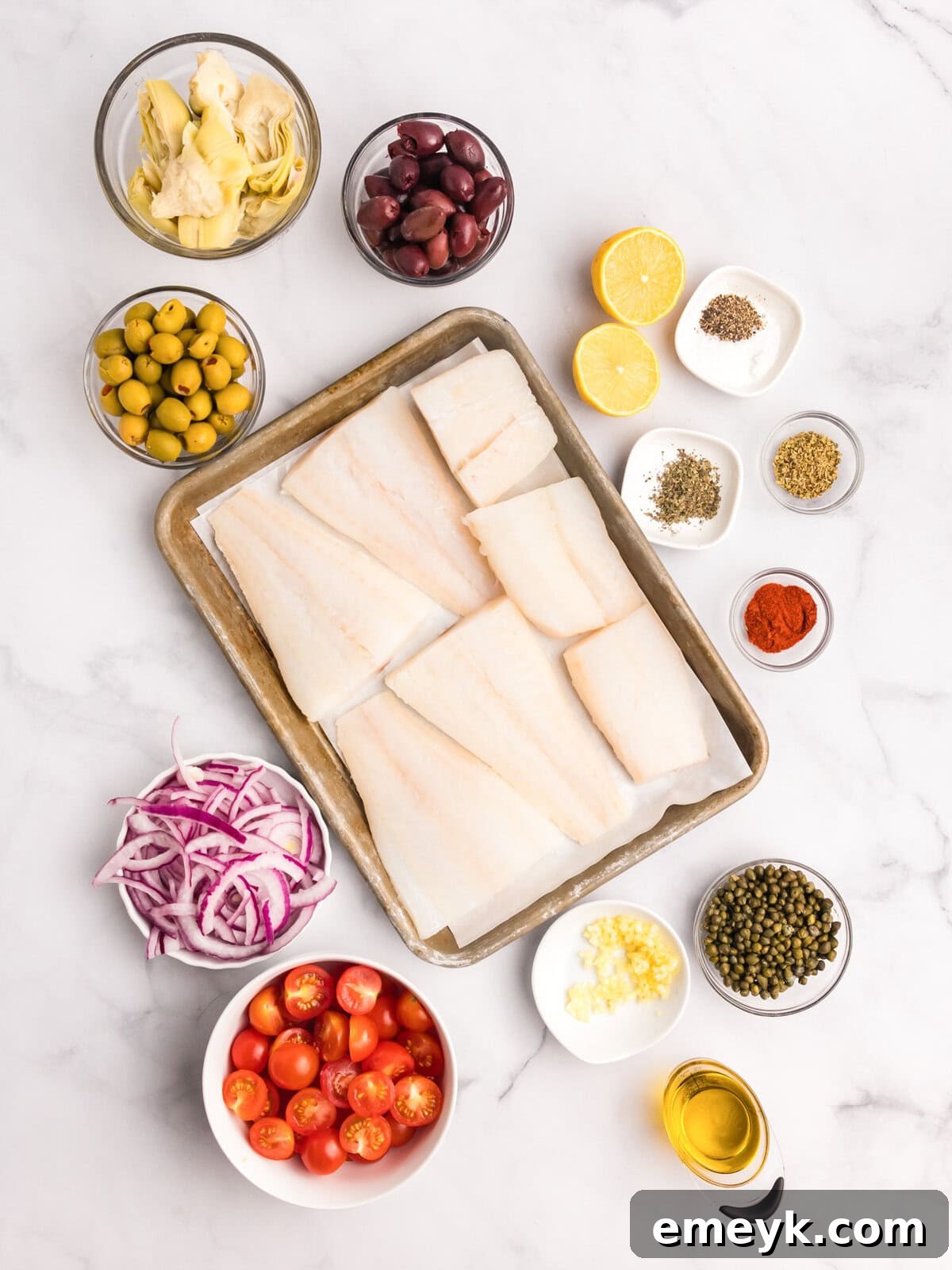 Sun-Kissed Mediterranean Fish Bake 5 Mediterranean Baked Fish recipe ingredients laid out on a table