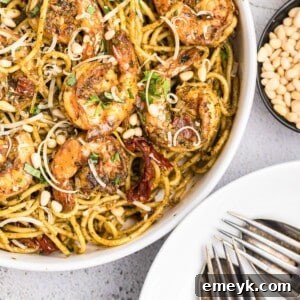 Vibrant Pesto Shrimp Pasta 11 Shrimp Pesto Pasta in a rustic bowl.