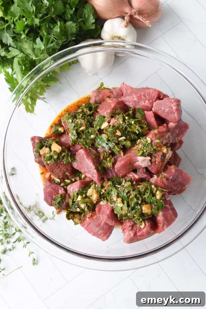 Mediterranean Steak Bites with marinade in bowl