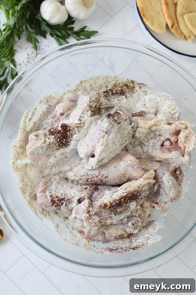 Sheet Pan Za’atar Chicken marinading in a bowl