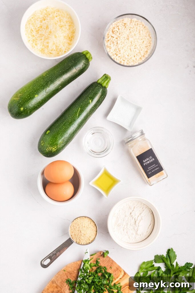 Crispy Air Fryer Zucchini Fries 6 A selection of fresh ingredients for Air Fryer Zucchini Fries and Garlic Lemon Aioli, including zucchini, eggs, breadcrumbs, and lemons.