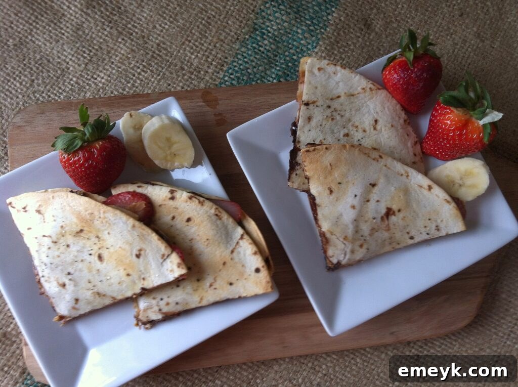 Close-up of a golden-brown dessert quesadilla, freshly cooked and glistening.