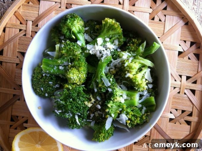 Roasted Lemon Parmesan Broccoli 3 Close-up of a bowl filled with vibrant green Lemon Parmesan Broccoli, showcasing its texture and seasoning.