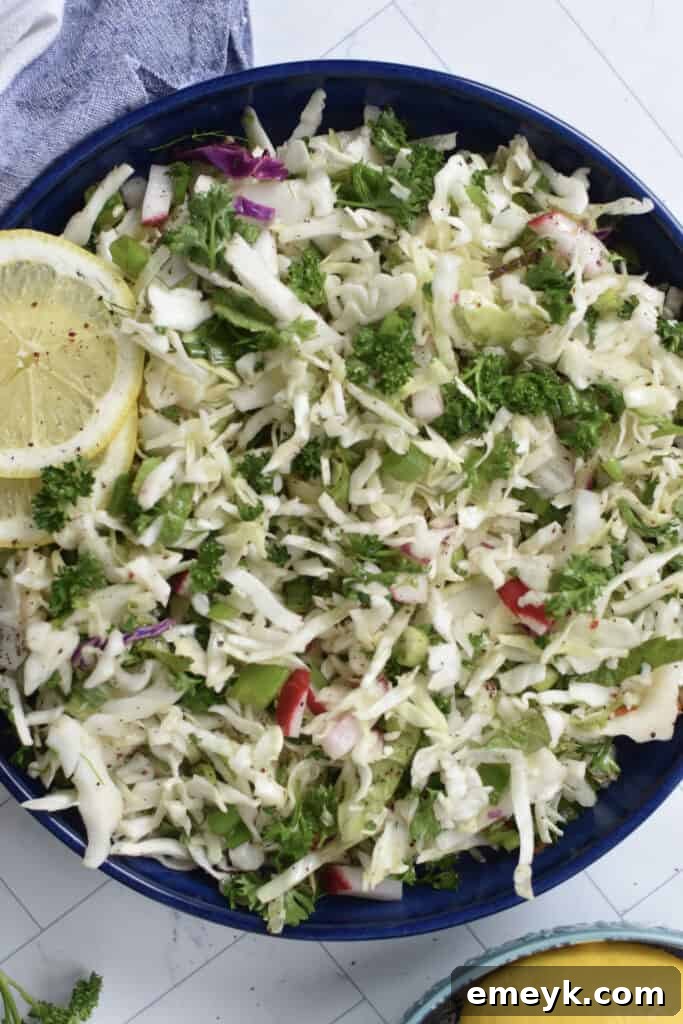 Malfouf Salad in a blue bowl with a lemon slice