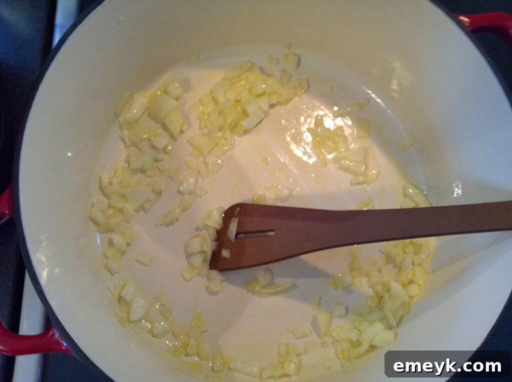 Sautéing onions and garlic for the smoked paprika mussel broth
