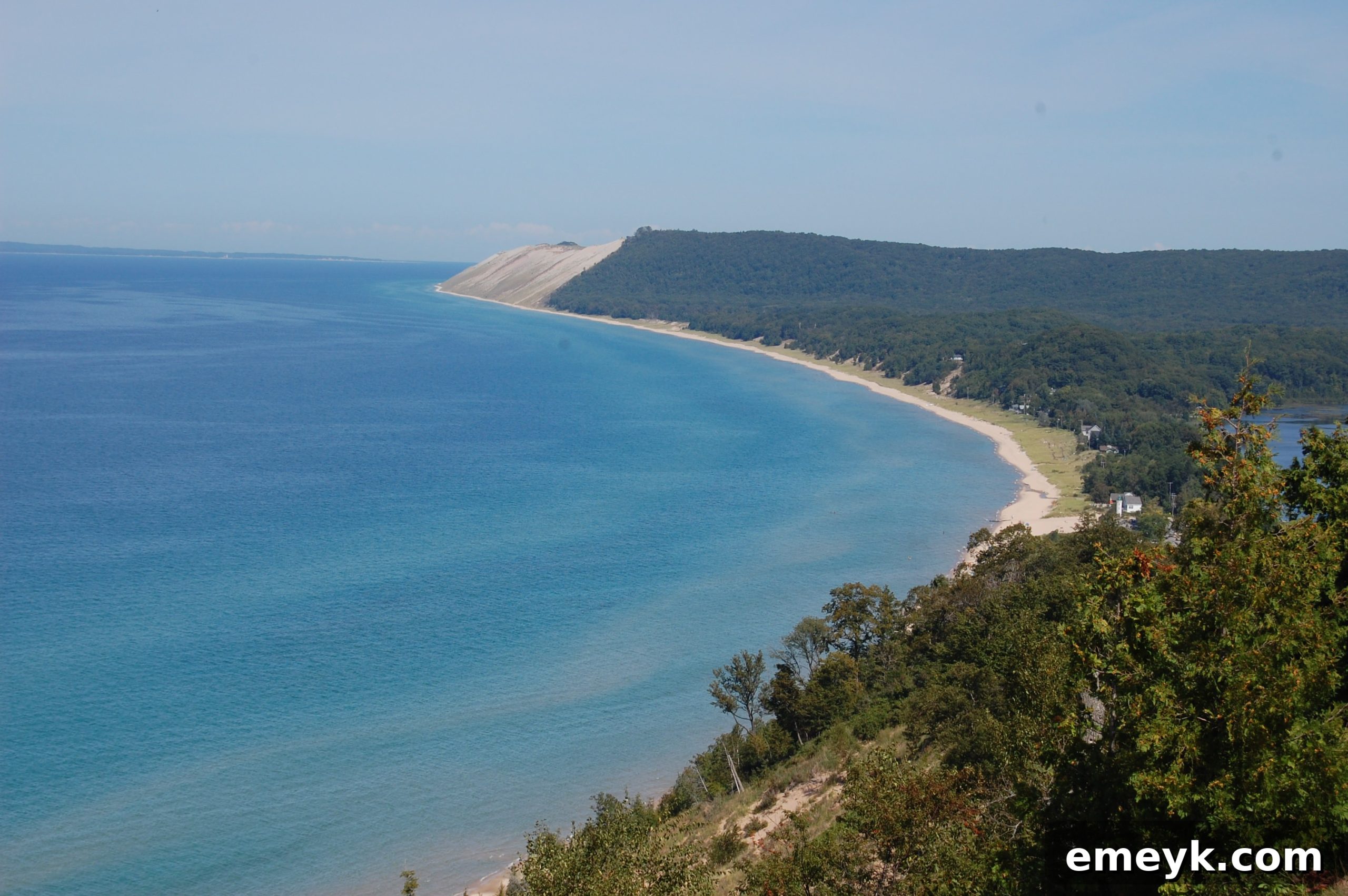 Empire Bluff Hike View Hikers enjoying the stunning view of Sleeping Bear Dunes and Lake Michigan from Empire Bluff.