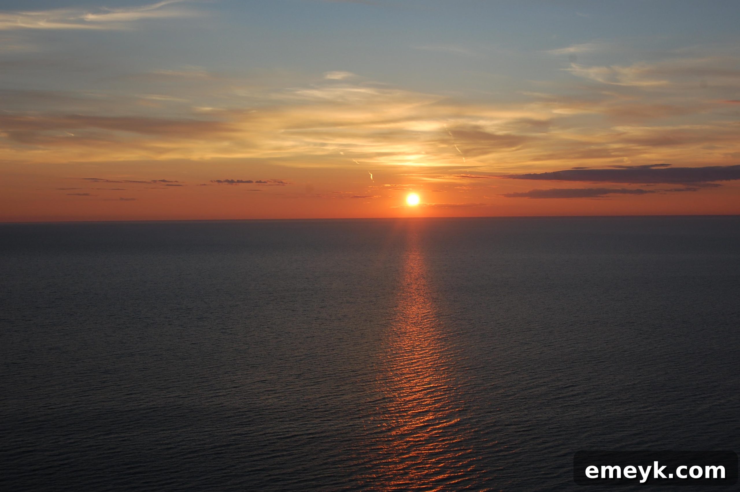 Lake Michigan Sunset Glow Serene sunset view over the water, capturing the tranquility of the moment.