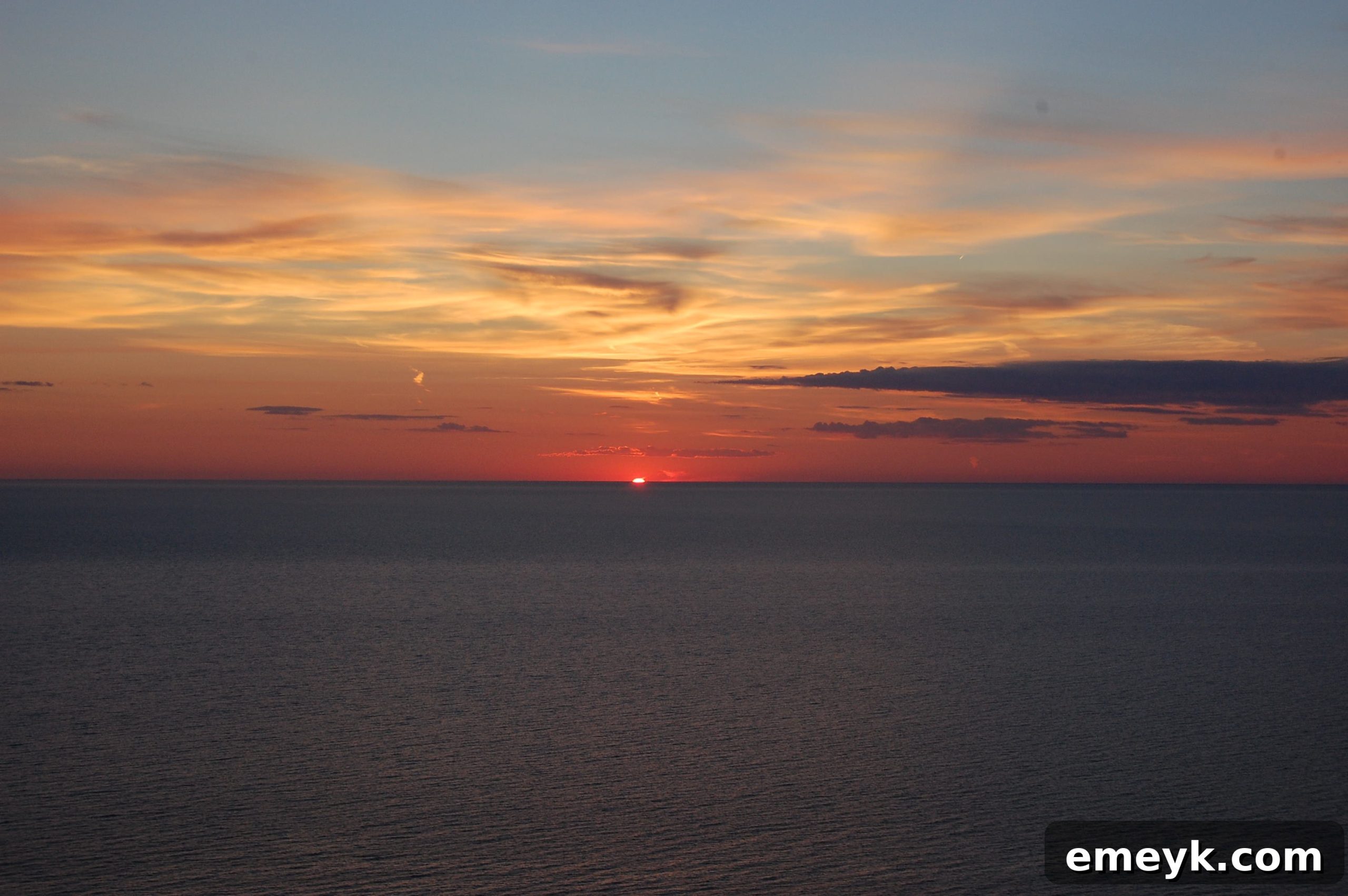 Golden Hour at Sleeping Bear Dunes The sun dipping below the horizon, casting a warm glow over Sleeping Bear Dunes.
