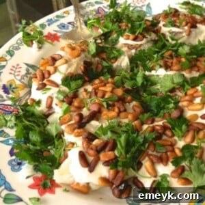Easy Baked White Fish Recipe with lemon and parsley on a wooden board.
