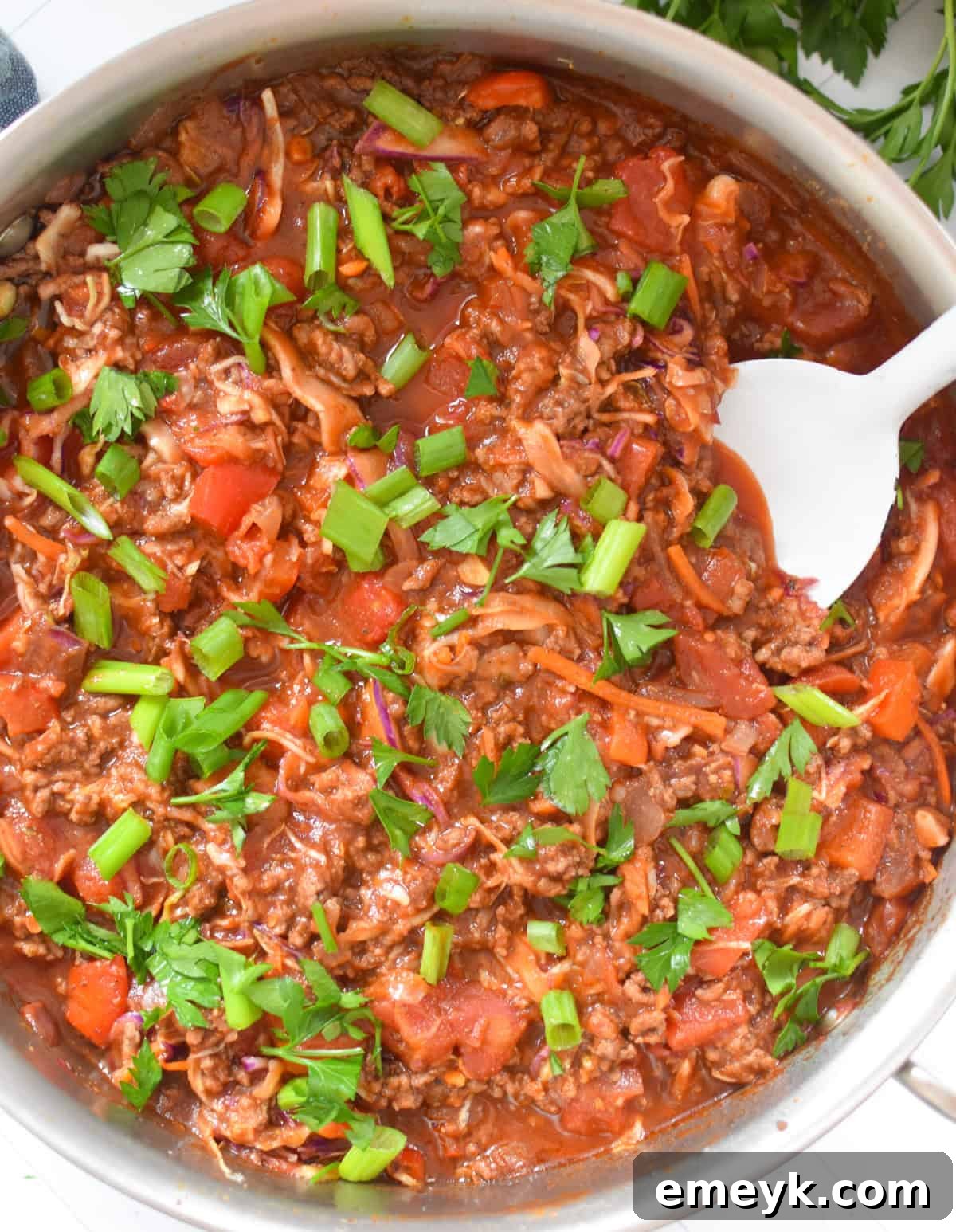 Zesty Mediterranean Beef and Cabbage Sauté 11 Mediterranean Beef and Cabbage Stir-fry with white spoon