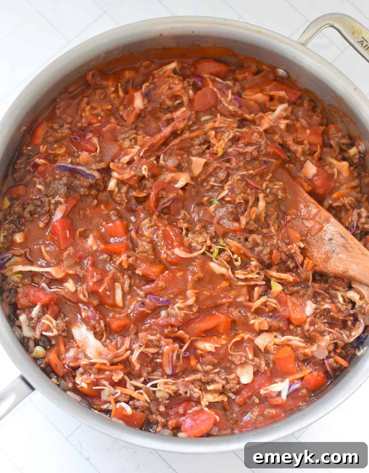 Zesty Mediterranean Beef and Cabbage Sauté 10 Mediterranean Beef and Cabbage Stir-fry with wooden spoon