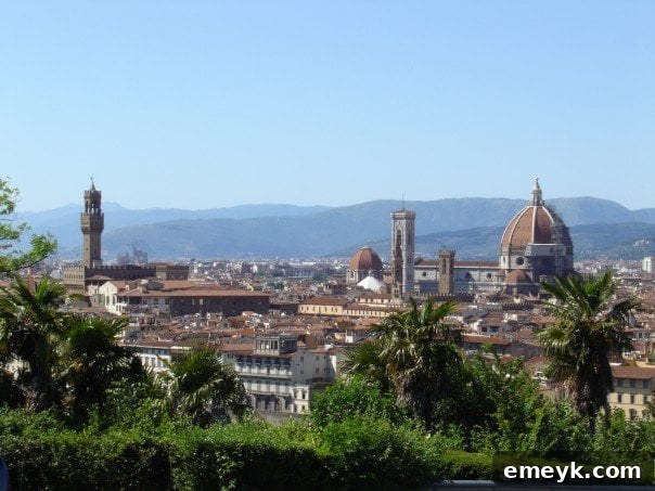 Florence street view with Duomo in the background, bustling with people