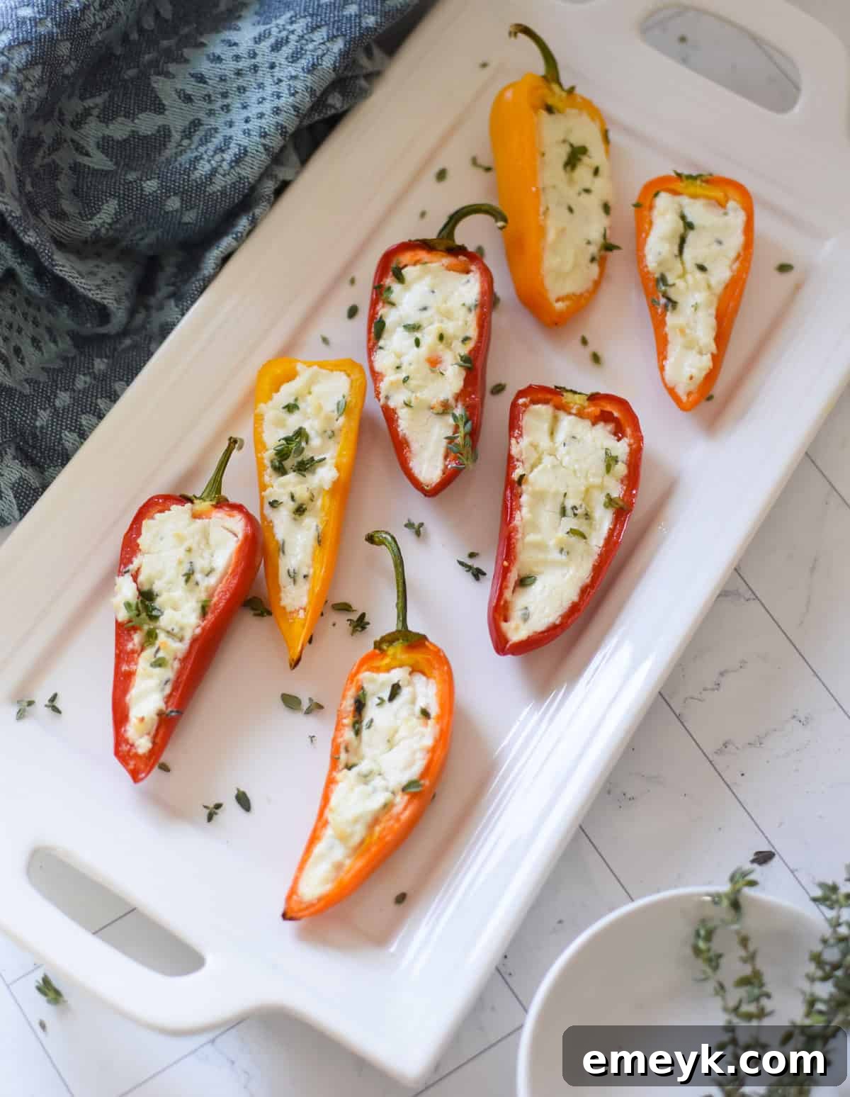 Creamy Goat Cheese-Filled Mini Peppers 13 A beautifully presented platter of Mediterranean Stuffed Mini Peppers Appetizers, ready for guests.