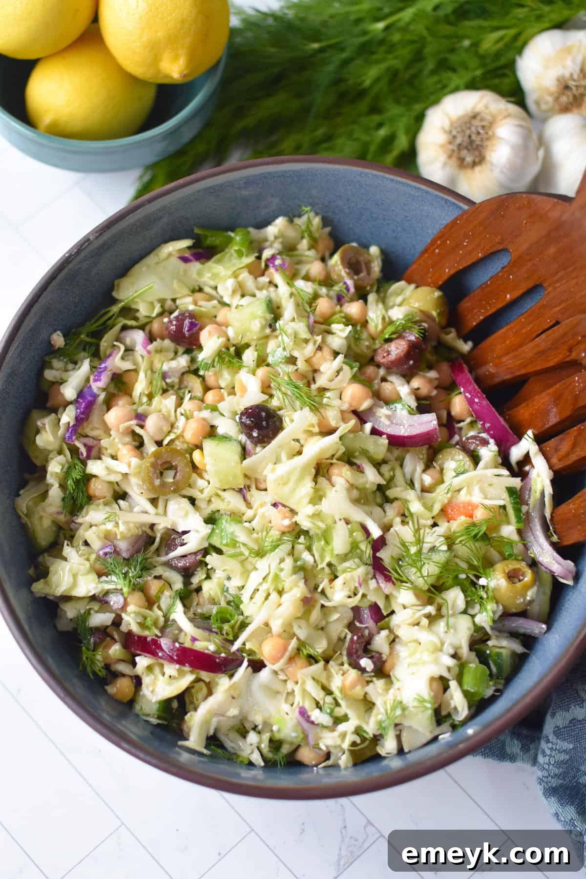 Appetizing Mediterranean Cabbage Salad with crumbled feta cheese visible on top.