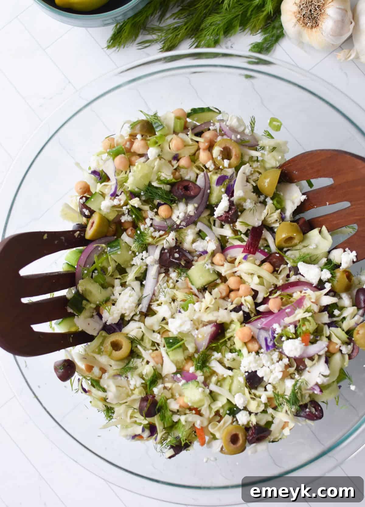 Close-up of the Greek Cabbage Salad dressing being prepared in a mason jar.