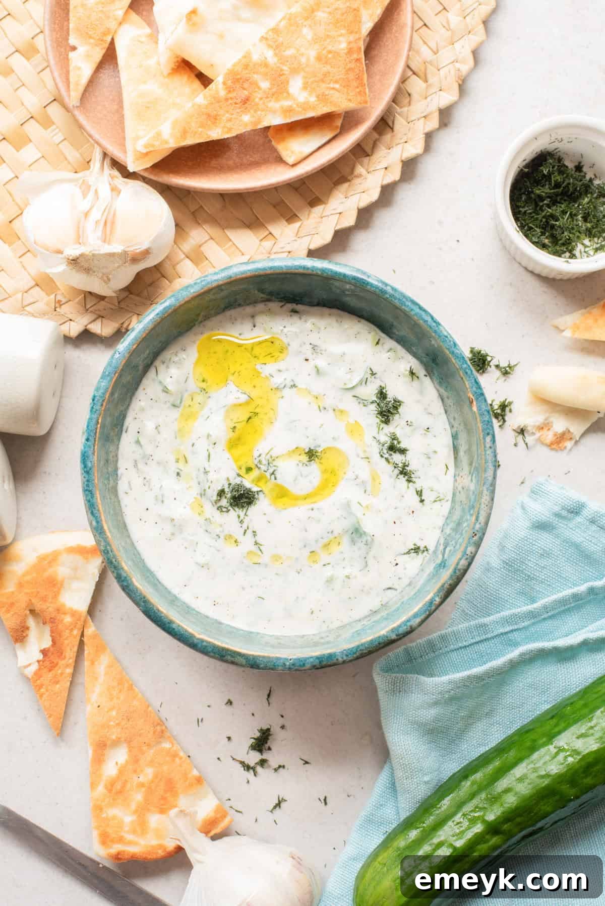 Fresh Cucumber Dill Yogurt Sauce in a blue bowl ready to serve