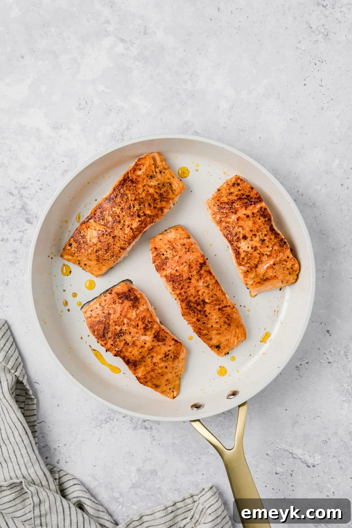 Marry Me Salmon - salmon filets in a skillet 