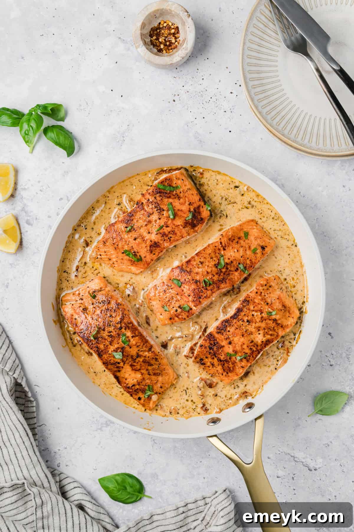 Marry Me Salmon in a skillet with sauce 