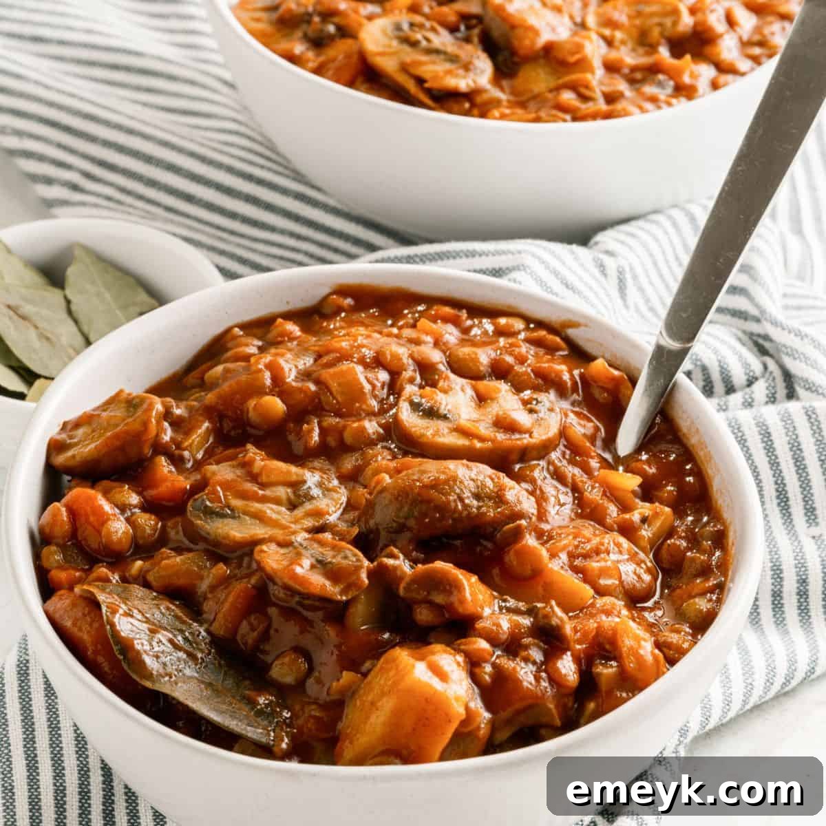 Savory Lentil Mushroom Stew, served in a deep bowl.