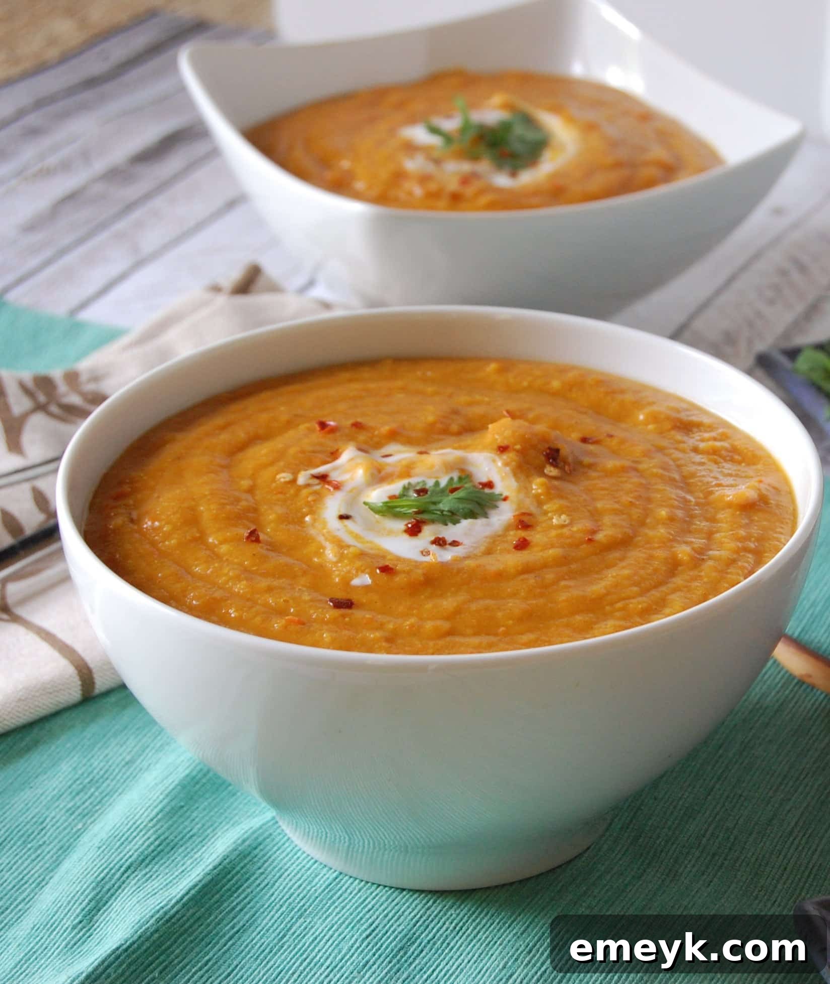 Moroccan Carrot Red Lentil Soup with a swirl of cream.