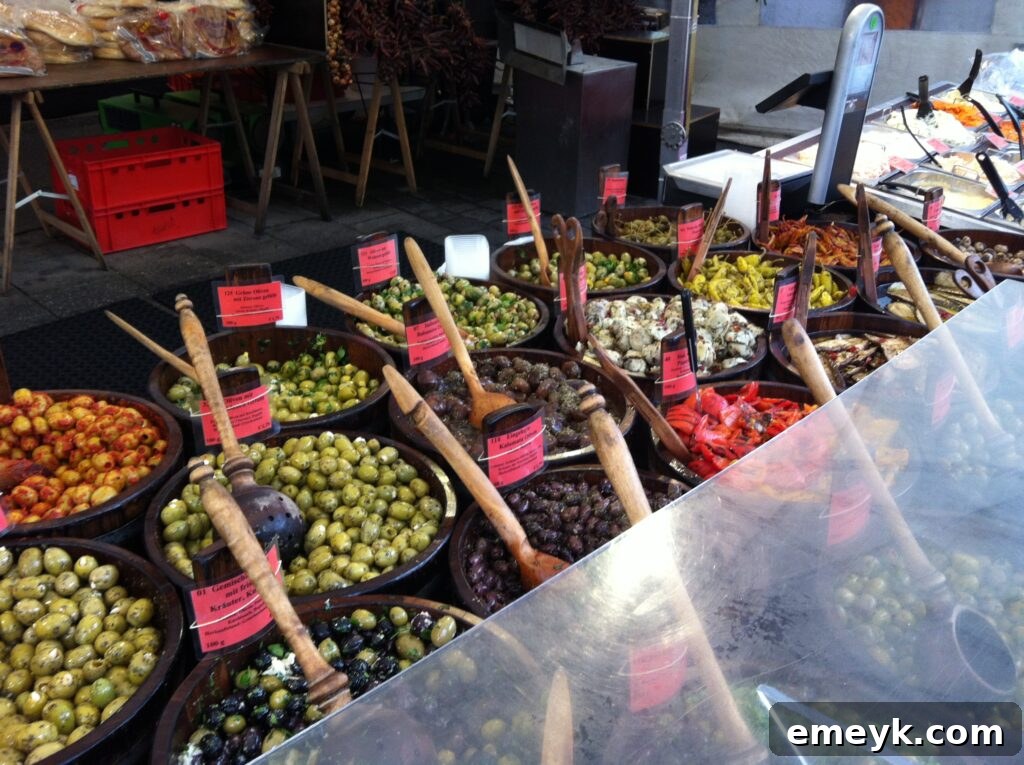 Rich assortment of olives and antipasti at a market stall in Munich, Germany