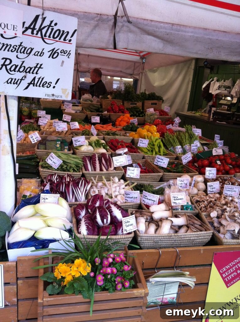 Colorful display of fresh vegetables at Viktualienmarkt in Munich, Germany