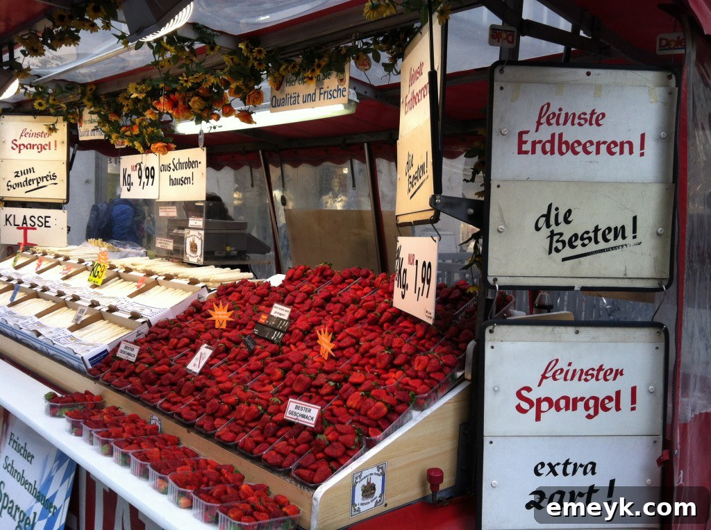 Close-up of fresh, ripe strawberries displayed at a market in Munich