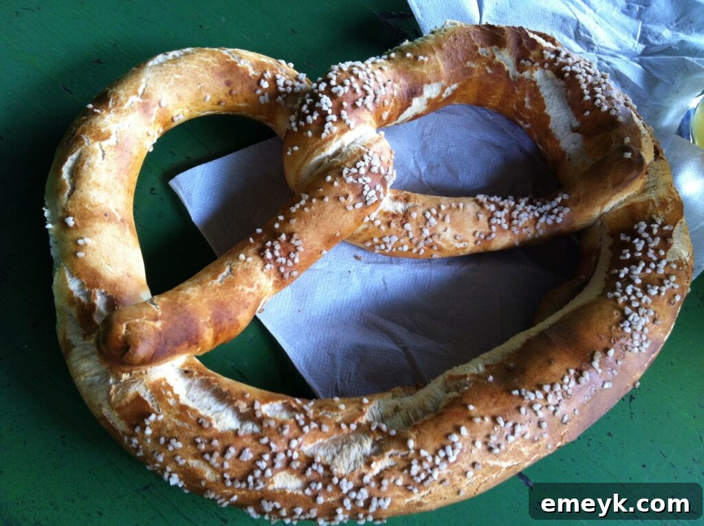 Large pretzel served at a German beer garden, a common sight in Munich, Germany