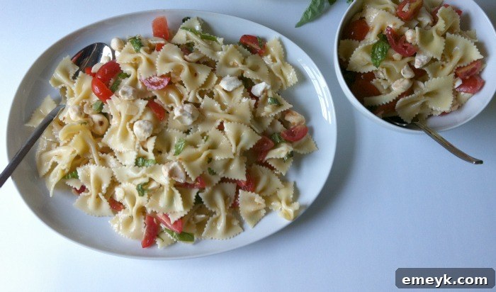 Vibrant Caprese Pasta 5 A delicious plate of Caprese Pasta Salad, ready to be enjoyed.