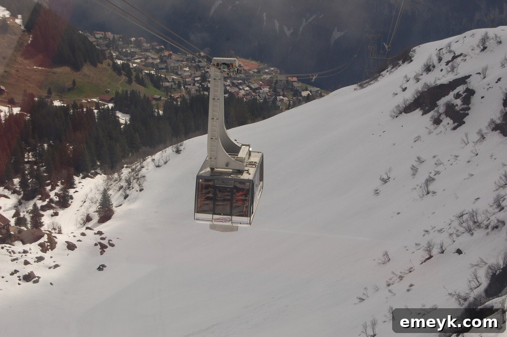Cable car transporting passengers over a breathtaking Alpine landscape in Interlaken, Switzerland