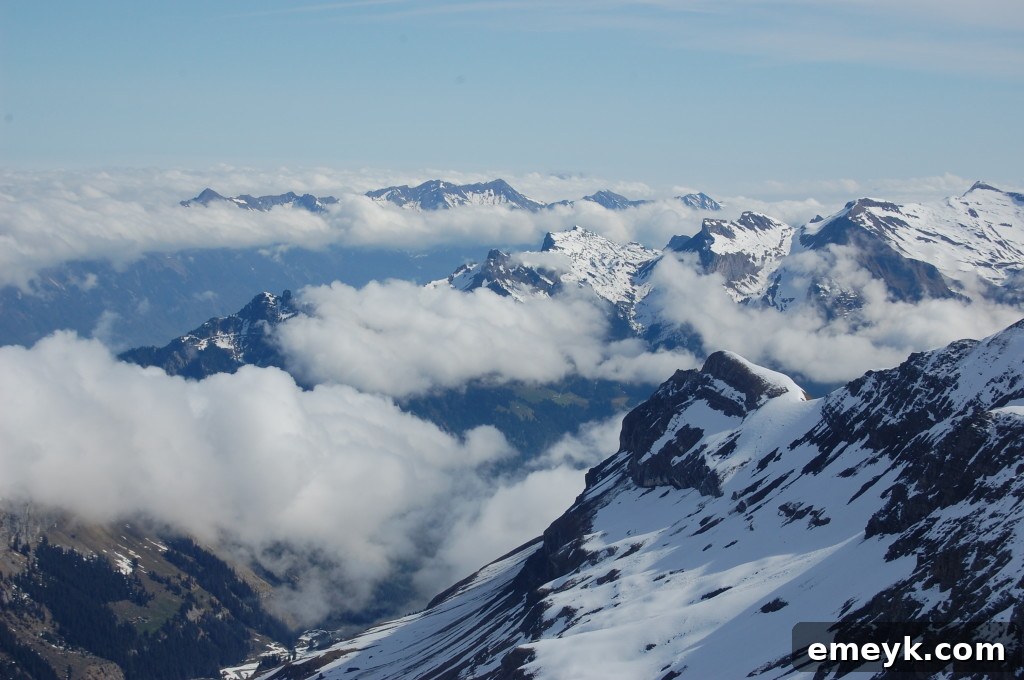 Traveler admiring the majestic Alpine scenery from the Schilthorn observation deck
