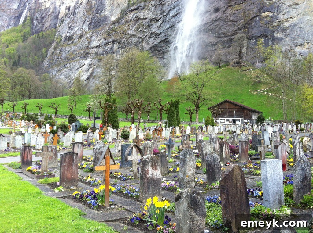 Peaceful cemetery in Lauterbrunnen, with traditional headstones and mountain backdrop