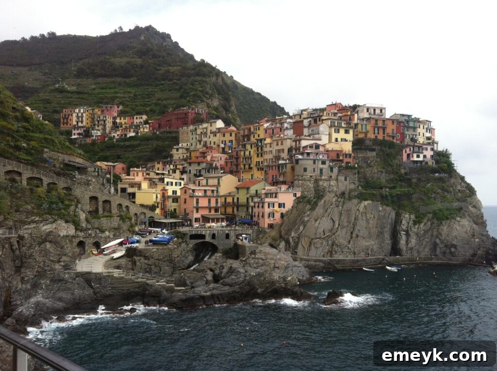 Breathtaking panoramic view of a colorful village in Cinque Terre, Italy, nestled by the Mediterranean sea