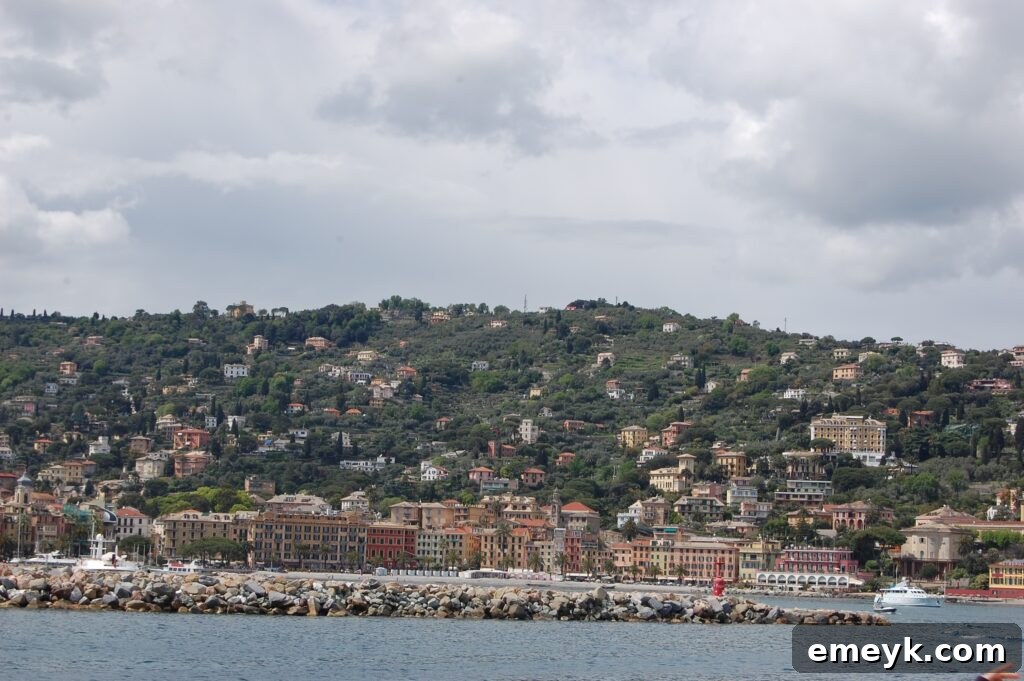 Santa Margherita Ligure harbor view with colorful boats and buildings under a clear sky