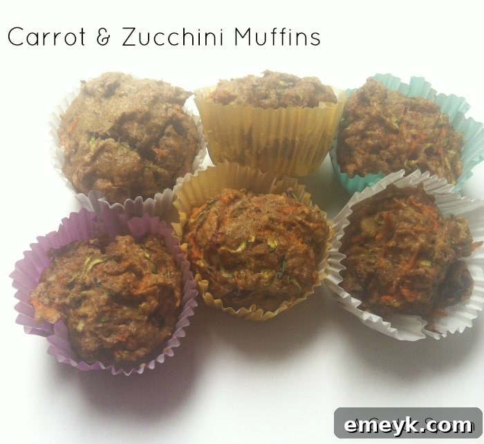 Moist Carrot and Zucchini Muffins fresh out of the oven on a cooling rack