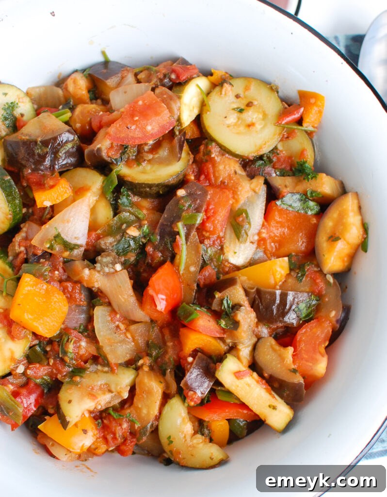 A vibrant bowl of traditional Ratatouille, showcasing fresh, colorful vegetables.