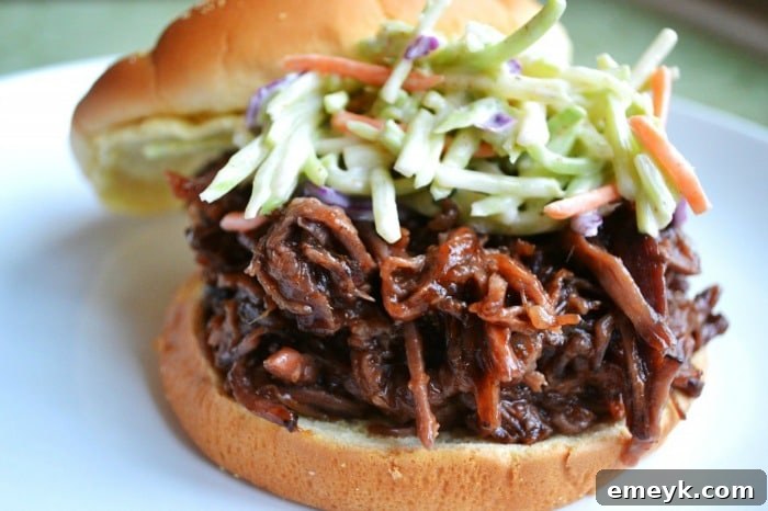 35 Stress Free Crockpot Meals for Back to School 16 Savory BBQ Beef Sandwich from Stuck on Sweet, featuring tender slow-cooked beef perfect for easy sandwiches.