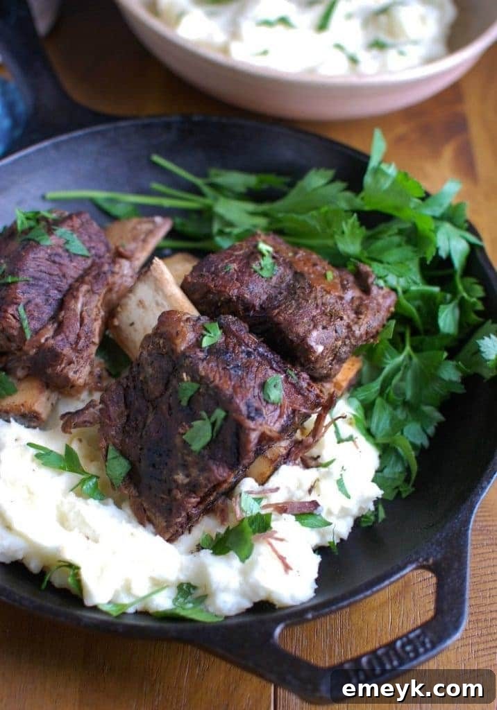 35 Stress Free Crockpot Meals for Back to School 9 Rich Slow Cooker Red Wine Short Ribs from A Cedar Spoon, a gourmet-quality meal made easy in the crockpot.