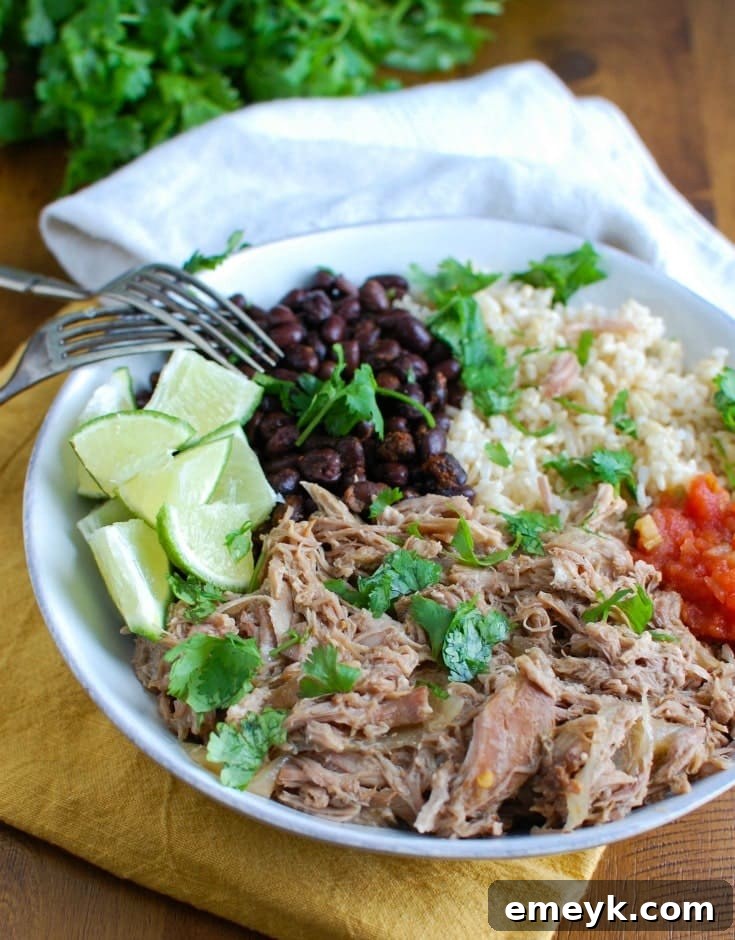 35 Stress Free Crockpot Meals for Back to School 10 Vibrant Cuban Pork Rice Bowls from A Cedar Spoon, featuring tender slow-cooked pork for a delicious and easy dinner.