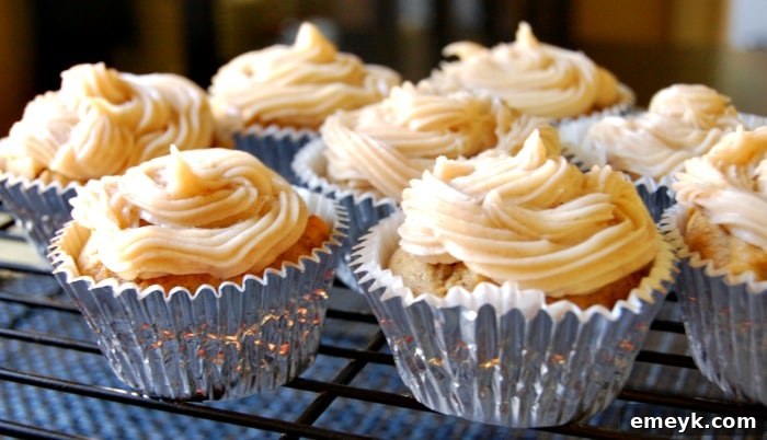 Delicious Pumpkin Cupcakes with Maple Cinnamon Cream Cheese Frosting ready for serving