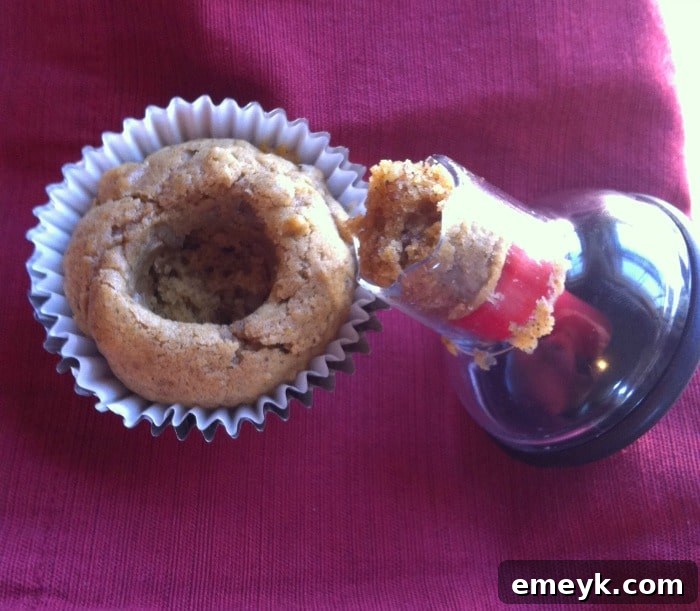OXO Cupcake Corer in action, removing the center from a baked cupcake