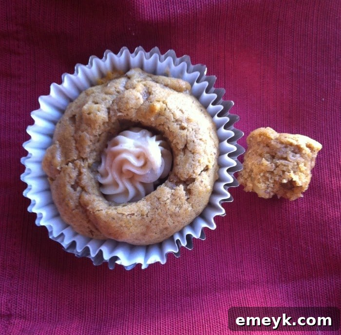 Pumpkin cupcakes filled with frosting using the OXO Cupcake Corer, ready for final frosting