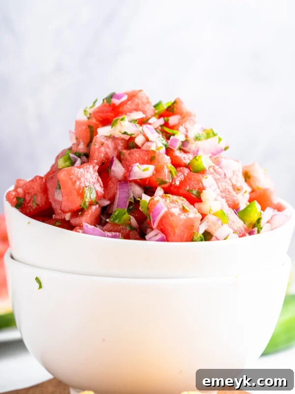 Easy Watermelon Salsa in a white bowl with a spoon