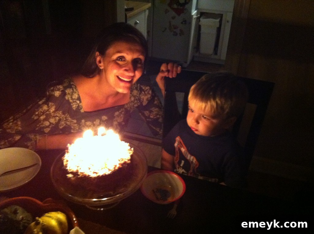 A happy family moment capturing a child and parent baking together in a cozy kitchen setting.