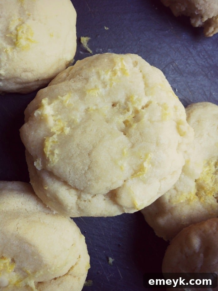 Sweet Lemon Surprise A Baby Shower for Liz 4 Close-up of Lemon Glazed Cookies, showcasing the glossy glaze and a sprinkle of zest
